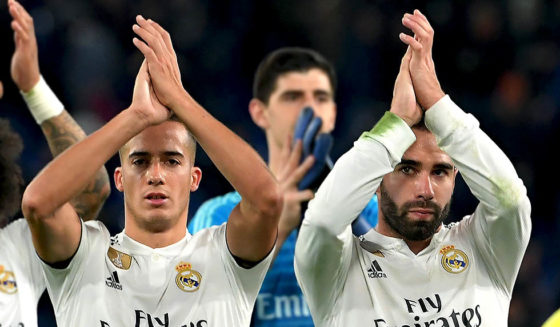 (From L) Real Madrid's Brazilian defender Marcelo, Real Madrid's Spanish midfielder Lucas Vazquez, Real Madrid's Belgian goalkeeper Thibaut Courtois (Rear) and Real Madrid's Spanish defender Dani Carvajal acknowledge the public at the end of the UEFA Champions League group G football match AS Rome vs Real Madrid on November 27, 2018 at the Olympic stadium in Rome. (Photo by Tiziana FABI / AFP) (Photo credit should read TIZIANA FABI/AFP/Getty Images)