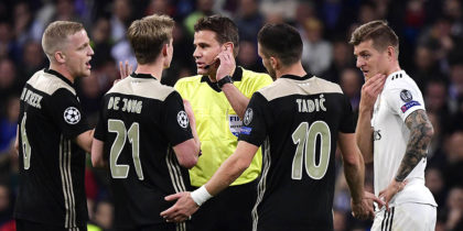 (FromL) Ajax's Dutch midfielder Donny van de Beek, Ajax's Dutch midfielder Frenkie de Jong, Ajax's Serbian forward Dusan Tadic and Real Madrid's German midfielder Toni Kroos argue with German referee Felix Brych during the UEFA Champions League round of 16 second leg football match between Real Madrid CF and Ajax at the Santiago Bernabeu stadium in Madrid on March 5, 2019. (Photo by JAVIER SORIANO / AFP) (Photo credit should read JAVIER SORIANO/AFP/Getty Images)