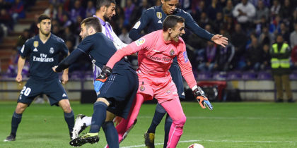 VALLADOLID, SPAIN - MARCH 10: Raphael Verane of Real Madrid beats goalkeeper Jordi Masip of Real Valladolid as he scores his team's first goal during the La Liga match between Real Valladolid CF and Real Madrid CF at Jose Zorrilla on March 10, 2019 in Valladolid, Spain. (Photo by Denis Doyle/Getty Images)