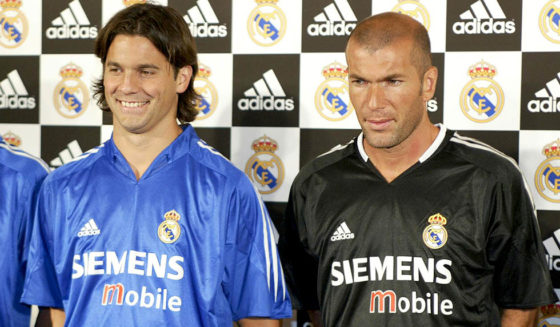 TOKYO, JAPAN: Fernando Morientes (L), Santiago Solari (C) and Zinedine Zidane (R) of Spanish football club team Real Madrid show off the team's new uniform during its press preview at a Tokyo hotel, 28 July 2004. AFP PHOTO/Toru YAMANAKA (Photo credit should read TORU YAMANAKA/AFP/Getty Images)