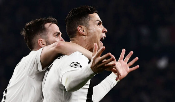 Juventus' Portuguese forward Cristiano Ronaldo (R) celebrates with Juventus' Bosnian midfielder Miralem Pjanic after scoring 2-0 during the UEFA Champions League round of 16 second-leg football match Juventus vs Atletico Madrid on March 12, 2019 at the Juventus stadium in Turin. (Photo by Marco BERTORELLO / AFP) (Photo credit should read MARCO BERTORELLO/AFP/Getty Images)