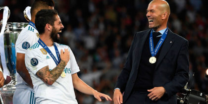 Real Madrid's Spanish midfielder Isco (C) jokes with Real Madrid's French coach Zinedine Zidane as Real Madrid players celebrate winning the UEFA Champions League final football match between Liverpool and Real Madrid at the Olympic Stadium in Kiev, Ukraine on May 26, 2018. - Real Madrid defeated Liverpool 3-1. (Photo by Paul ELLIS / AFP) (Photo credit should read PAUL ELLIS/AFP/Getty Images)