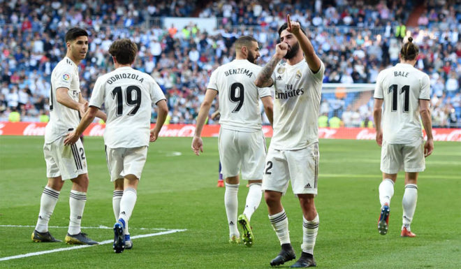 MADRID, SPAIN - MARCH 16: Isco of Real Madrid celebrates with teammates after scoring his team's first goal during the La Liga match between Real Madrid CF and RC Celta de Vigo at Estadio Santiago Bernabeu on March 16, 2019 in Madrid, Spain. (Photo by Denis Doyle/Getty Images)