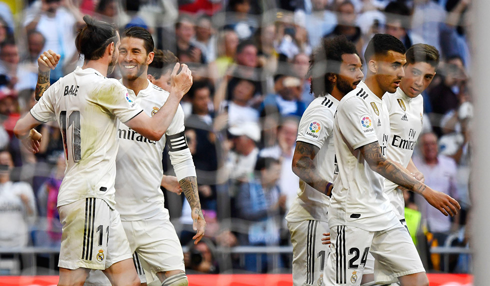Real Madrid's Welsh forward Gareth Bale (L) celebrates his goal with Real Madrid's Spanish defender Sergio Ramos during the Spanish league football match between Real Madrid CF and RC Celta de Vigo at the Santiago Bernabeu stadium in Madrid on March 16, 2019. (Photo by GABRIEL BOUYS / AFP) (Photo credit should read GABRIEL BOUYS/AFP/Getty Images)