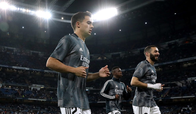 MADRID, SPAIN - MARCH 02: Karim Benzema (R) of Real Madrid CF leaves the pitch after his warming up followed by his teammates Gareth Bale (L), Sergio Reguilon (2ndL) and Vinicius Junior (R) before the La Liga match between Real Madrid CF and FC Barcelona at Estadio Santiago Bernabeu on March 02, 2019 in Madrid, Spain. (Photo by Gonzalo Arroyo Moreno/Getty Images)
