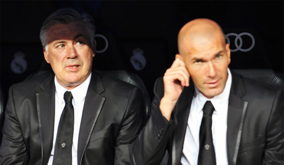 Real Madrid's Italian coach Carlo Ancelotti (L) and Real Madrid's first team Director Zinedine Zidane (R) look on before the Spanish league football match Real Madrid CF vs Real Betis at the Santiago Bernabeu stadium in Madrid on August 18, 2012. AFP PHOTO / GERARD JULIEN (Photo credit should read GERARD JULIEN/AFP/Getty Images)