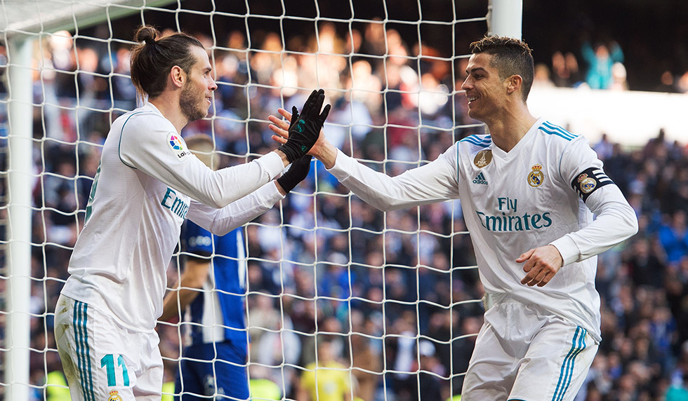 MADRID, SPAIN - FEBRUARY 24: Gareth Bale of Real Madrid celebrates with Cristiano Ronaldo after scoring his team's second goal during the La Liga match between Real Madrid and Deportivo Alaves at Estadio Santiago Bernabeu on February 24, 2018 in Madrid, Spain. (Photo by Denis Doyle/Getty Images)