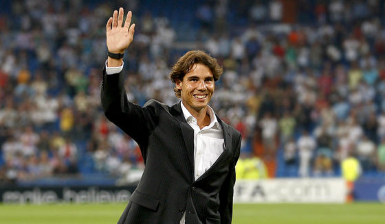 Rafael Nadal MADRID, SPAIN - SEPTEMBER 15: Tennis player Rafael Nadal greets prior to the start of the UEFA Champions League group G match between Real Madrid and AFC Ajax at Estadio Santiago Bernabeu on September 15, 2010 in Madrid, Spain. (Photo by Angel Martinez/Getty Images)