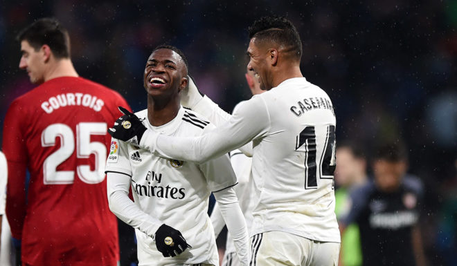 MADRID, SPAIN - JANUARY 19: Vinicius Junior of Real Madrid celebrates his teams second goal with Casemiro of Real Madrid during the La Liga match between Real Madrid CF and Sevilla FC at Estadio Santiago Bernabeu on January 19, 2019 in Madrid, Spain. (Photo by Denis Doyle/Getty Images)