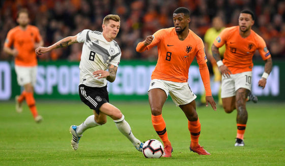 Germany's midfielder Toni Kroos (L) vies with Netherlands' midfielder Georginio Wijnaldum during the UEFA Euro 2020 Group C qualification football match between The Netherlands and Germany at the Johan Cruyff Arena in Amsterdam on March 24, 2019. (Photo by JOHN THYS / AFP) (Photo credit should read JOHN THYS/AFP/Getty Images)