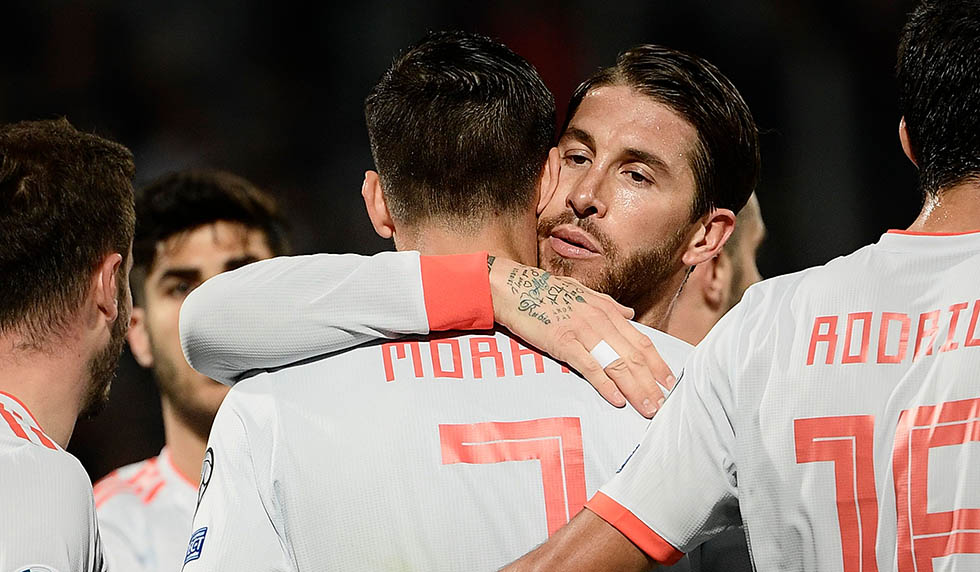 Spain's defender Sergio Ramos (C-R) embraces Spain's forward Alvaro Morata after Morata opened the scoring during the Euro 2020 Group F qualifying football match Malta vs Spain on March 26, 2019 at the Ta' Qali Stadium in Malta. (Photo by Filippo MONTEFORTE / AFP) (Photo credit should read FILIPPO MONTEFORTE/AFP/Getty Images)