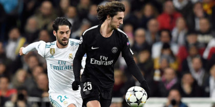 Real Madrid's Spanish midfielder Isco (L) vies with Paris Saint-Germain's French midfielder Adrien Rabiot (R) during the UEFA Champions League round of sixteen first leg football match Real Madrid CF against Paris Saint-Germain (PSG) at the Santiago Bernabeu stadium in Madrid on February 14, 2018. / AFP PHOTO / GABRIEL BOUYS (Photo credit should read GABRIEL BOUYS/AFP/Getty Images)