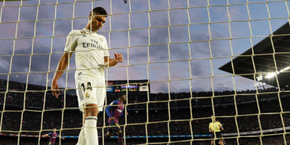 Real Madrid's Brazilian midfielder Casemiro goes for the ball after Barcelona's Uruguayan forward Luis Suarez's goal during the Spanish league football match between FC Barcelona and Real Madrid CF at the Camp Nou stadium in Barcelona on October 28, 2018. (Photo by LLUIS GENE / AFP) (Photo credit should read LLUIS GENE/AFP/Getty Images)
