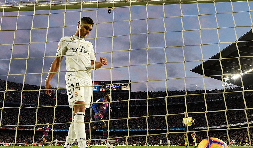 Real Madrid's Brazilian midfielder Casemiro goes for the ball after Barcelona's Uruguayan forward Luis Suarez's goal during the Spanish league football match between FC Barcelona and Real Madrid CF at the Camp Nou stadium in Barcelona on October 28, 2018. (Photo by LLUIS GENE / AFP) (Photo credit should read LLUIS GENE/AFP/Getty Images)