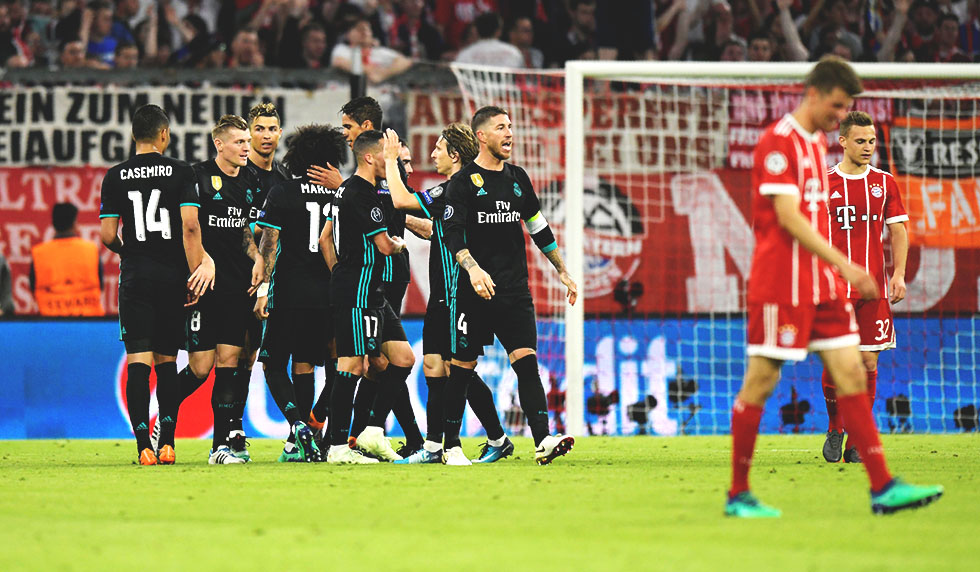 Real Madrid's Brazilian defender Marcelo (C) is congratulated by teamamtes after scoring during the UEFA Champions League semi-final first-leg football match FC Bayern Munich v Real Madrid CF in Munich, southern Germany on April 25, 2018. (Photo by GUENTER SCHIFFMANN / AFP) (Photo credit should read GUENTER SCHIFFMANN/AFP/Getty Images)