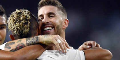 TOPSHOT - Real Madrid's Spanish-Dominican forward Mariano (2R) celebrates his goal with Real Madrid's Spanish defender Sergio Ramos (R) during the UEFA Champions League group G football match between Real Madrid CF and AS Roma at the Santiago Bernabeu stadium in Madrid on September 19, 2018. (Photo by GABRIEL BOUYS / AFP) (Photo credit should read GABRIEL BOUYS/AFP/Getty Images)