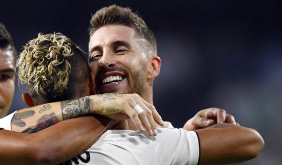 TOPSHOT - Real Madrid's Spanish-Dominican forward Mariano (2R) celebrates his goal with Real Madrid's Spanish defender Sergio Ramos (R) during the UEFA Champions League group G football match between Real Madrid CF and AS Roma at the Santiago Bernabeu stadium in Madrid on September 19, 2018. (Photo by GABRIEL BOUYS / AFP) (Photo credit should read GABRIEL BOUYS/AFP/Getty Images)