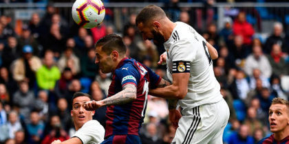 Real Madrid's French forward Karim Benzema (R) scores a goal during the Spanish league football match between Real Madrid CF and SD Eibar at the Santiago Bernabeu stadium in Madrid on April 6, 2019. (Photo by GABRIEL BOUYS / AFP) (Photo credit should read GABRIEL BOUYS/AFP/Getty Images)
