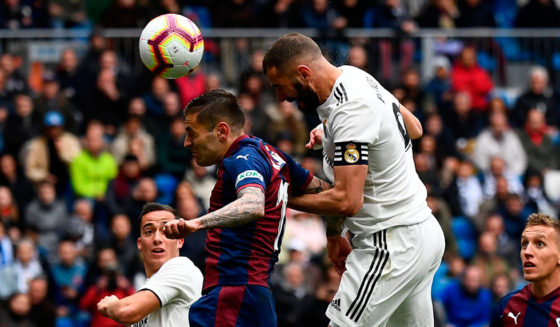 Real Madrid's French forward Karim Benzema (R) scores a goal during the Spanish league football match between Real Madrid CF and SD Eibar at the Santiago Bernabeu stadium in Madrid on April 6, 2019. (Photo by GABRIEL BOUYS / AFP) (Photo credit should read GABRIEL BOUYS/AFP/Getty Images)