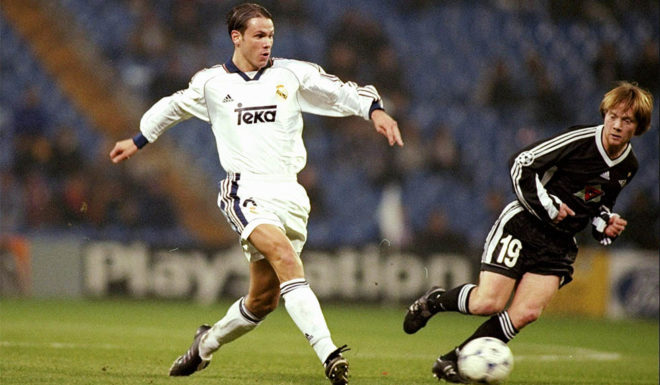 Fernando Redondo of Real Madrid is watched by Fredrik Winsnes of Rosenborg during the UEFA Champions League group C match at the Bernabeu Stadium in Madrid, Spain. Real Madrid won 3-1. \ Mandatory Credit: Clive Mason /Allsport