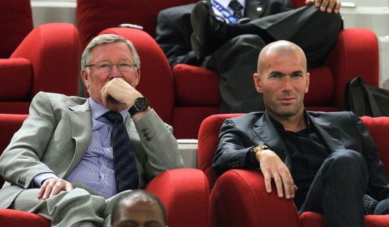 Manchester United manager Sir Alex Ferguson (L) and France's former footballer Zinedine Zidane attend a friendly football match between Brazil and Argentina at Khalifa Stadium in Doha on November 17, 2010