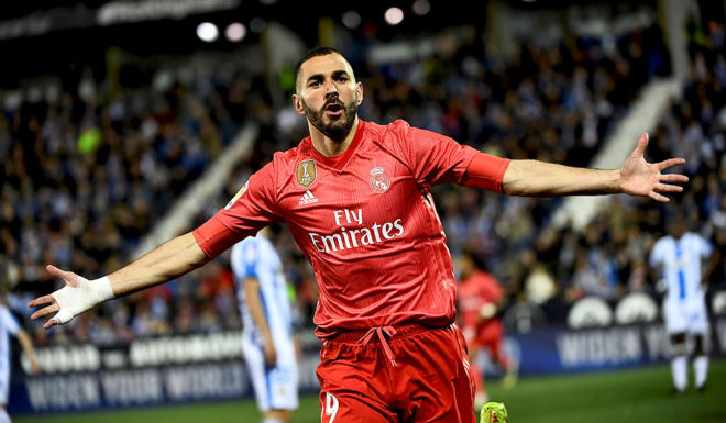 Real Madrid's French forward Karim Benzema celebrates after scoring during the Spanish league football match between Club Deportivo Leganes SAD and Real Madrid CF at the Estadio Municipal Butarque in Leganes on April 15, 2019. (Photo by PIERRE-PHILIPPE MARCOU / AFP) (Photo credit should read PIERRE-PHILIPPE MARCOU/AFP/Getty Images)