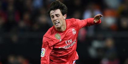 VALENCIA, SPAIN - APRIL 03: Alvaro Odriozola of Real Madrid is tackled by Goncalo Guedes of Valencia during the La Liga match between Valencia CF and Real Madrid CF at Estadio Mestalla on April 03, 2019 in Valencia, Spain. (Photo by David Ramos/Getty Images)