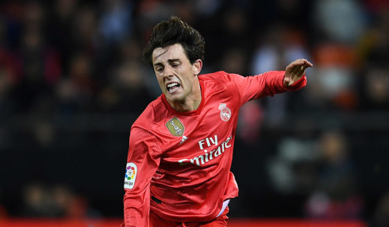 VALENCIA, SPAIN - APRIL 03: Alvaro Odriozola of Real Madrid is tackled by Goncalo Guedes of Valencia during the La Liga match between Valencia CF and Real Madrid CF at Estadio Mestalla on April 03, 2019 in Valencia, Spain. (Photo by David Ramos/Getty Images)