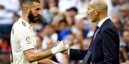 TOPSHOT - Real Madrid's French forward Karim Benzema (L) greets Real Madrid's French coach Zinedine Zidane as he leaves the pitch during the Spanish league football match between Real Madrid CF and RC Celta de Vigo at the Santiago Bernabeu stadium in Madrid on March 16, 2019. (Photo by GABRIEL BOUYS / AFP) (Photo credit should read GABRIEL BOUYS/AFP/Getty Images)