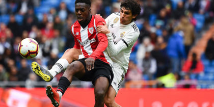 Athletic Bilbao's Spanish forward Inaki Williams (L) challenges Real Madrid's Spanish defender Jesus Vallejo during the Spanish League football match between Real Madrid and Athletic Bilbao at the Santiago Bernabeu Stadium in Madrid on April 21, 2019. (Photo by GABRIEL BOUYS / AFP) (Photo credit should read GABRIEL BOUYS/AFP/Getty Images)