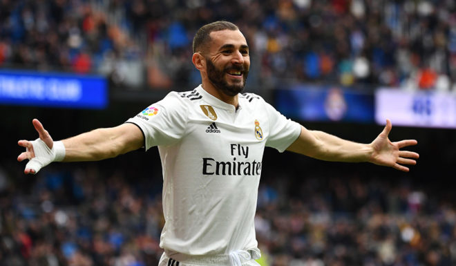 Real Madrid's French forward Karim Benzema celebrates after scoring a goal during the Spanish League football match between Real Madrid and Athletic Bilbao at the Santiago Bernabeu Stadium in Madrid on April 21, 2019. (Photo by GABRIEL BOUYS / AFP) (Photo credit should read GABRIEL BOUYS/AFP/Getty Images)