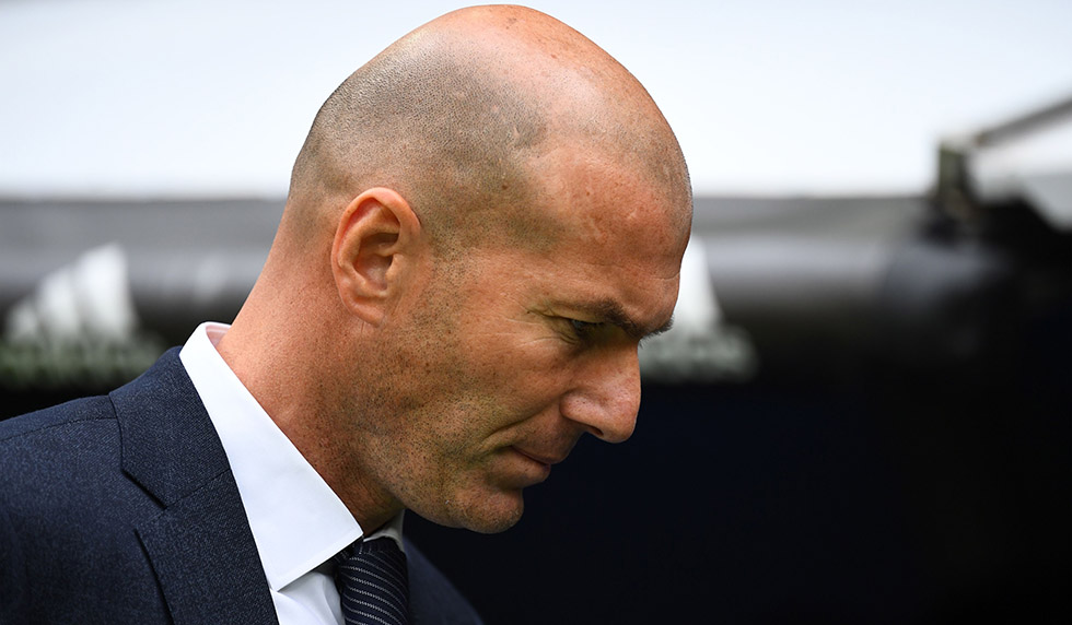 Real Madrid's French coach Zinedine Zidane waits for the start of the Spanish League football match between Real Madrid and Athletic Bilbao at the Santiago Bernabeu Stadium in Madrid on April 21, 2019. (Photo by GABRIEL BOUYS / AFP) (Photo credit should read GABRIEL BOUYS/AFP/Getty Images)