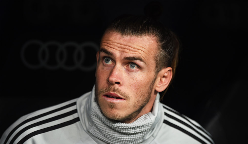 MADRID, SPAIN - SEPTEMBER 22: Gareth Bale of Real Madrid looks on from the subs bench before the start of the La Liga match between Real Madrid CF and RCD Espanyol at Estadio Santiago Bernabeu on September 22, 2018 in Madrid, Spain. (Photo by Denis Doyle/Getty Images,)