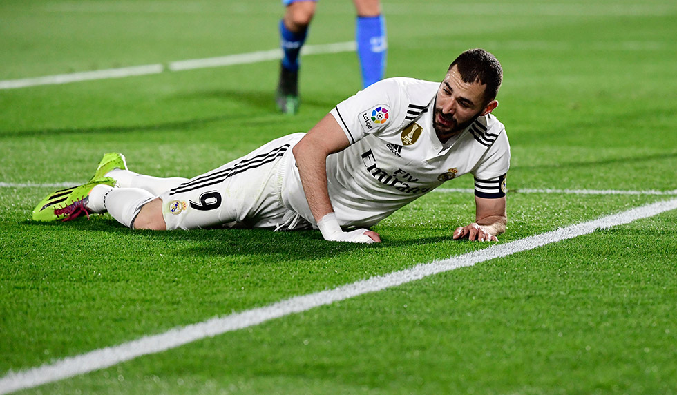 Real Madrid's French forward Karim Benzema lies on the field during the Spanish league football match between Getafe CF and Real Madrid CF at the Col. Alfonso Perez stadium in Getafe on April 25, 2019. (Photo by JAVIER SORIANO / AFP) (Photo credit should read JAVIER SORIANO/AFP/Getty Images)