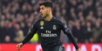 Real Madrid's Spanish midfielder Marco Asensio runs with the ball during the UEFA Champions league round of 16 first leg football match between Ajax Amsterdam and Real Madrid at the Johan Cruijff ArenA on February 13, 2019. (Photo by EMMANUEL DUNAND / AFP) (Photo credit should read EMMANUEL DUNAND/AFP/Getty Images)
