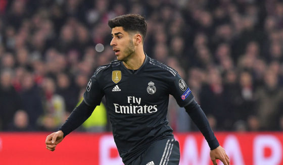 Real Madrid's Spanish midfielder Marco Asensio runs with the ball during the UEFA Champions league round of 16 first leg football match between Ajax Amsterdam and Real Madrid at the Johan Cruijff ArenA on February 13, 2019. (Photo by EMMANUEL DUNAND / AFP) (Photo credit should read EMMANUEL DUNAND/AFP/Getty Images)