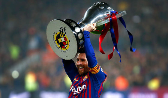 Barcelona's Argentinian forward Lionel Messi celebrates with the Liga trophy as Barcelona won their 26th league title after the Spanish League football match between Barcelona and Levante at the Camp Nou stadium in Barcelona on April 27, 2019. (Photo by PAU BARRENA / AFP) (Photo credit should read PAU BARRENA/AFP/Getty Images)