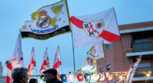 MADRID, SPAIN - APRIL 08: People buy at a merchandaising stall before the La Liga match between Rayo Vallecano de Madrid and Real Madrid CF at Vallecas Stadium outdoors on April 8, 2015 in Madrid, Spain. (Photo by Gonzalo Arroyo Moreno/Getty Images)