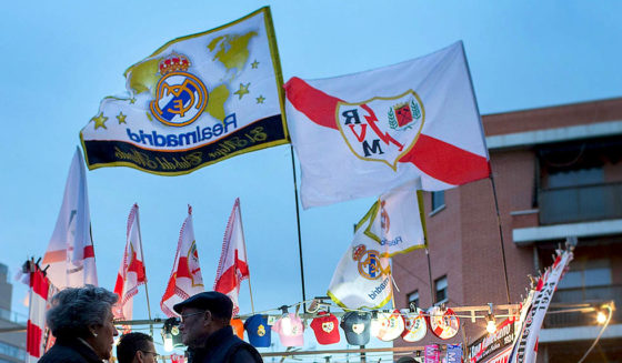 MADRID, SPAIN - APRIL 08: People buy at a merchandaising stall before the La Liga match between Rayo Vallecano de Madrid and Real Madrid CF at Vallecas Stadium outdoors on April 8, 2015 in Madrid, Spain. (Photo by Gonzalo Arroyo Moreno/Getty Images)
