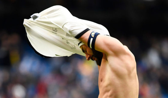 Real Madrid's French forward Karim Benzema takes his jersey off at the end of the Spanish league football match between Real Madrid CF and SD Eibar at the Santiago Bernabeu stadium in Madrid on April 6, 2019. (Photo by GABRIEL BOUYS / AFP) (Photo credit should read GABRIEL BOUYS/AFP/Getty Images)