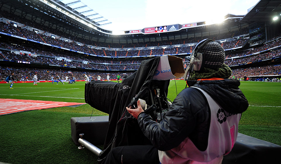 MADRID, SPAIN - FEBRUARY 15: A Mediapro television cameraman films the La Liga match between Real Madrid CF and RC Deportivo La Coruna at Estadio Santiago Bernabeu on February 15, 2015 in Madrid, Spain. La Liga clubs are threatening to go on strike if the government doesn't introduce legislation to allow collective sharing of TV rights. (Photo by Denis Doyle/Getty Images)