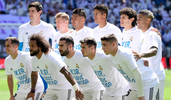 Real Madrid players pose sporting t-shirts in support of Porto's Spanish goalkeeper Iker Casillas before the Spanish league football match between Real Madrid CF and Villarreal CF at the Santiago Bernabeu stadium in Madrid on May 5, 2019. (Photo by JAVIER SORIANO / AFP) (Photo credit should read JAVIER SORIANO/AFP/Getty Images)