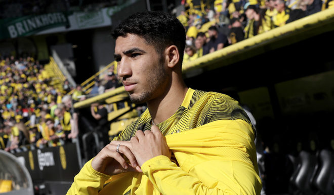 DORTMUND, GERMANY - MARCH 30: Achraf Hakimi of Dortmund warms up prior to the Bundesliga match between Borussia Dortmund and VfL Wolfsburg at Signal Iduna Park on March 30, 2019 in Dortmund, Germany. (Photo by Christof Koepsel/Bongarts/Getty Images)