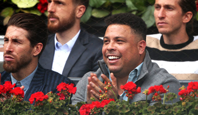 MADRID, SPAIN - MAY 08: Former Brazilian football player Ronaldo watches on as Rafael Nadal plays Felix Auger-Aliassime during day five of the Mutua Madrid Open at La Caja Magica on May 08, 2019 in Madrid, Spain. (Photo by Alex Pantling/Getty Images)