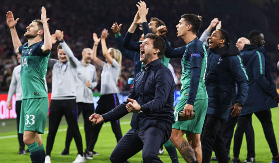 Tottenham's Argentine coach Mauricio Pochettino (C) and players of Tottenham Hotspur jubilate after winning the UEFA Champions League semi-final second leg football match between Ajax Amsterdam and Tottenham Hotspur at the Johan Cruyff Arena, in Amsterdam, on May 8, 2019. - Tottenham fought back from three goals down on aggregate to stun Ajax 3-2 and set up a Champions League final against Liverpool. (Photo by Olaf Kraak / ANP / AFP) / Netherlands OUT (Photo credit should read OLAF KRAAK/AFP/Getty Images)
