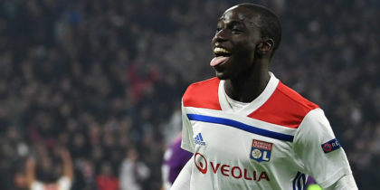 LYON, FRANCE - NOVEMBER 27: Maxwel Cornet of Olympique Lyonnais (27) celebrates as he scores his team's first goal with Ferland Mendy (22) during the UEFA Champions League Group F match between Olympique Lyonnais and Manchester City at Groupama Stadium on November 27, 2018 in Lyon, France. (Photo by Shaun Botterill/Getty Images)