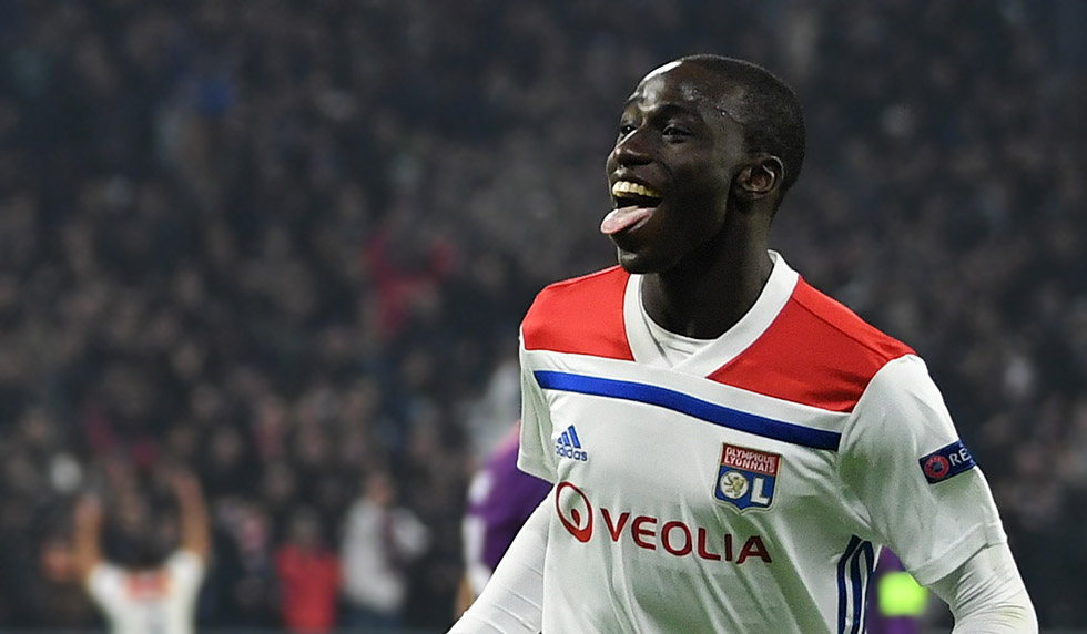LYON, FRANCE - NOVEMBER 27: Maxwel Cornet of Olympique Lyonnais (27) celebrates as he scores his team's first goal with Ferland Mendy (22) during the UEFA Champions League Group F match between Olympique Lyonnais and Manchester City at Groupama Stadium on November 27, 2018 in Lyon, France. (Photo by Shaun Botterill/Getty Images)