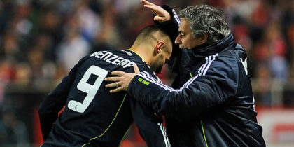 Real Madrid's French forward Karim Benzema (L) celebrates with Real Madrid's Portuguese coach Jose Mourinho after scoring during the Spanish King's Cup (Copa del Rey) semifinal first leg football match Sevilla FC vs Real Madrid on January 26, 2011 at the Ramon Sanchez Pizjuan stadium in Sevilla. AFP PHOTO/ CRISTINA QUICLER (Photo credit should read CRISTINA QUICLER/AFP/Getty Images)