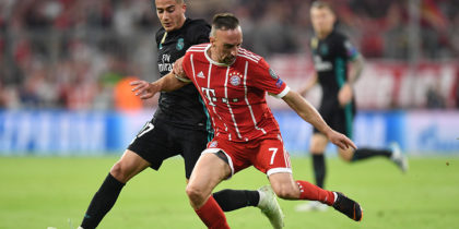 Bayern Munich's French midfielder Franck Ribery (R) challenges Real Madrid's Spanish midfielder Lucas Vazquez during the UEFA Champions League semi-final first-leg football match FC Bayern Munich v Real Madrid CF in Munich in southern Germany on April 25, 2018. (Photo by Christof STACHE / AFP) (Photo credit should read CHRISTOF STACHE/AFP/Getty Images)