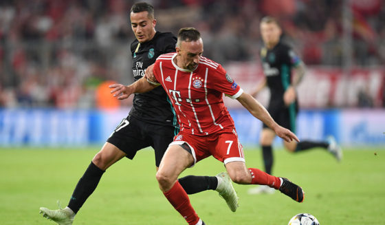 Bayern Munich's French midfielder Franck Ribery (R) challenges Real Madrid's Spanish midfielder Lucas Vazquez during the UEFA Champions League semi-final first-leg football match FC Bayern Munich v Real Madrid CF in Munich in southern Germany on April 25, 2018. (Photo by Christof STACHE / AFP) (Photo credit should read CHRISTOF STACHE/AFP/Getty Images)